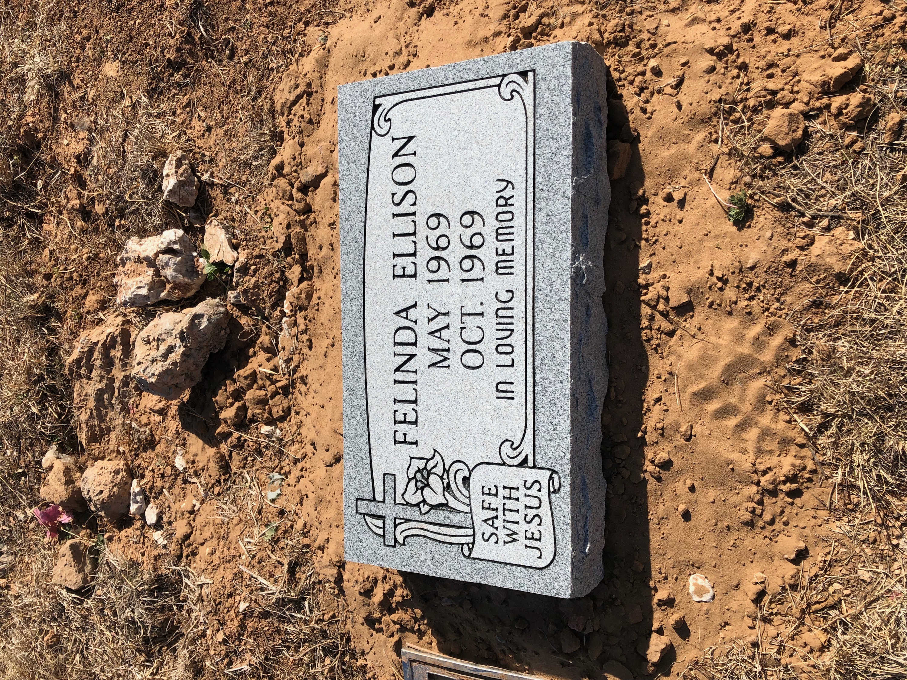 Granite flat headstone with integrated bronze vase